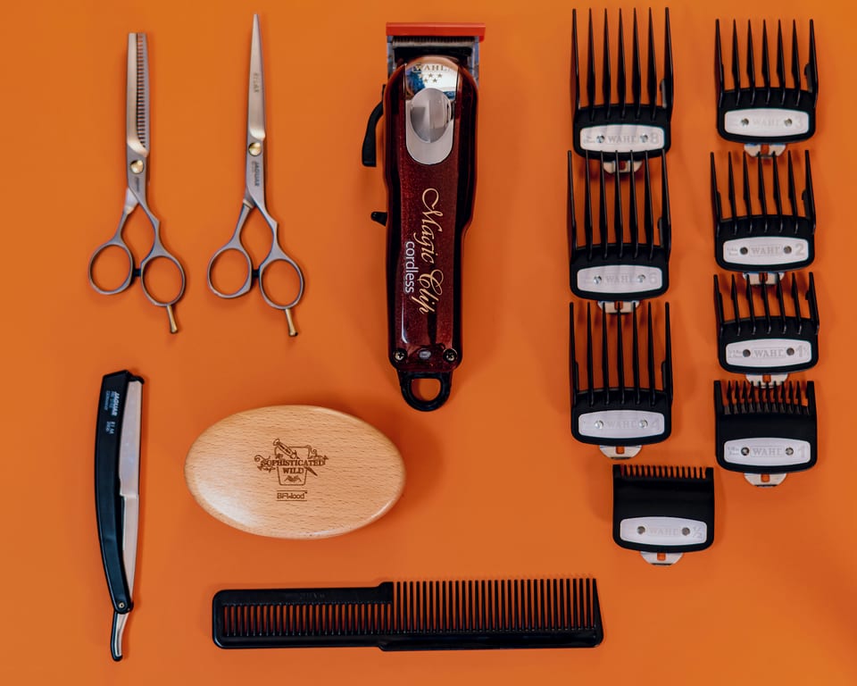 Scissors and a comb on a work surface